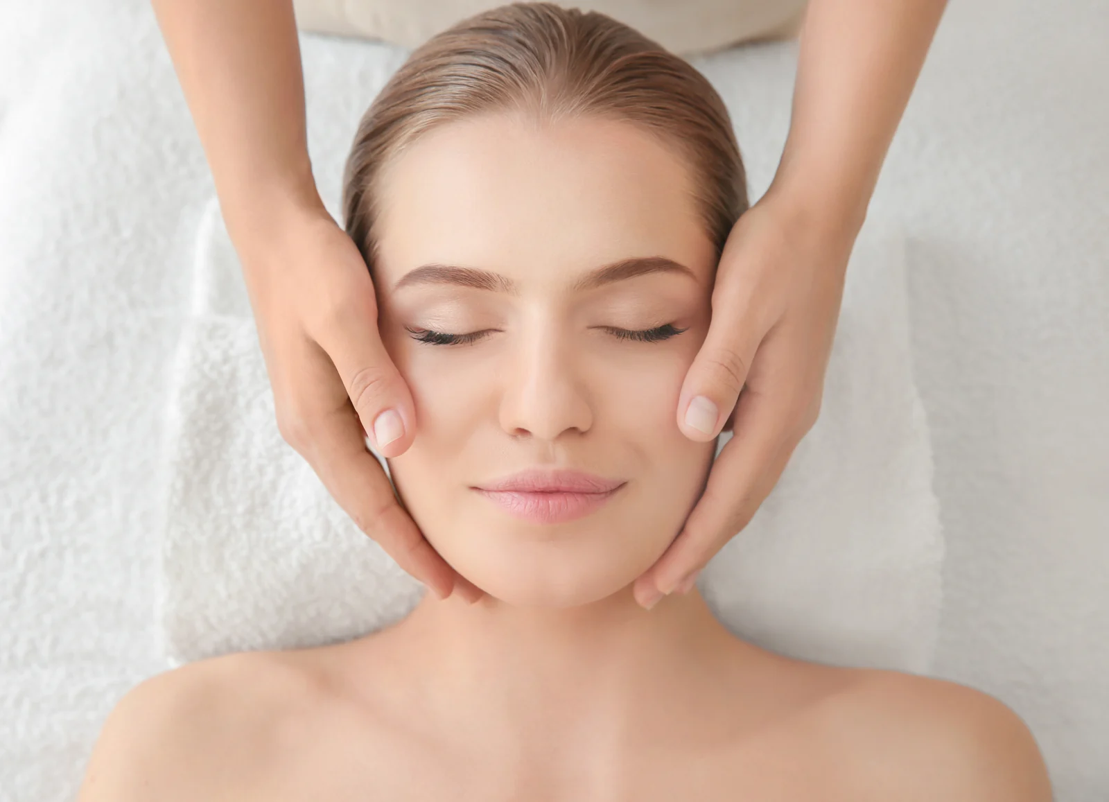 A woman resting with her eyes closed at a Thonotosassa, FL medical spa, reflecting the minimal downtime while hyaluronidase dissolves filler