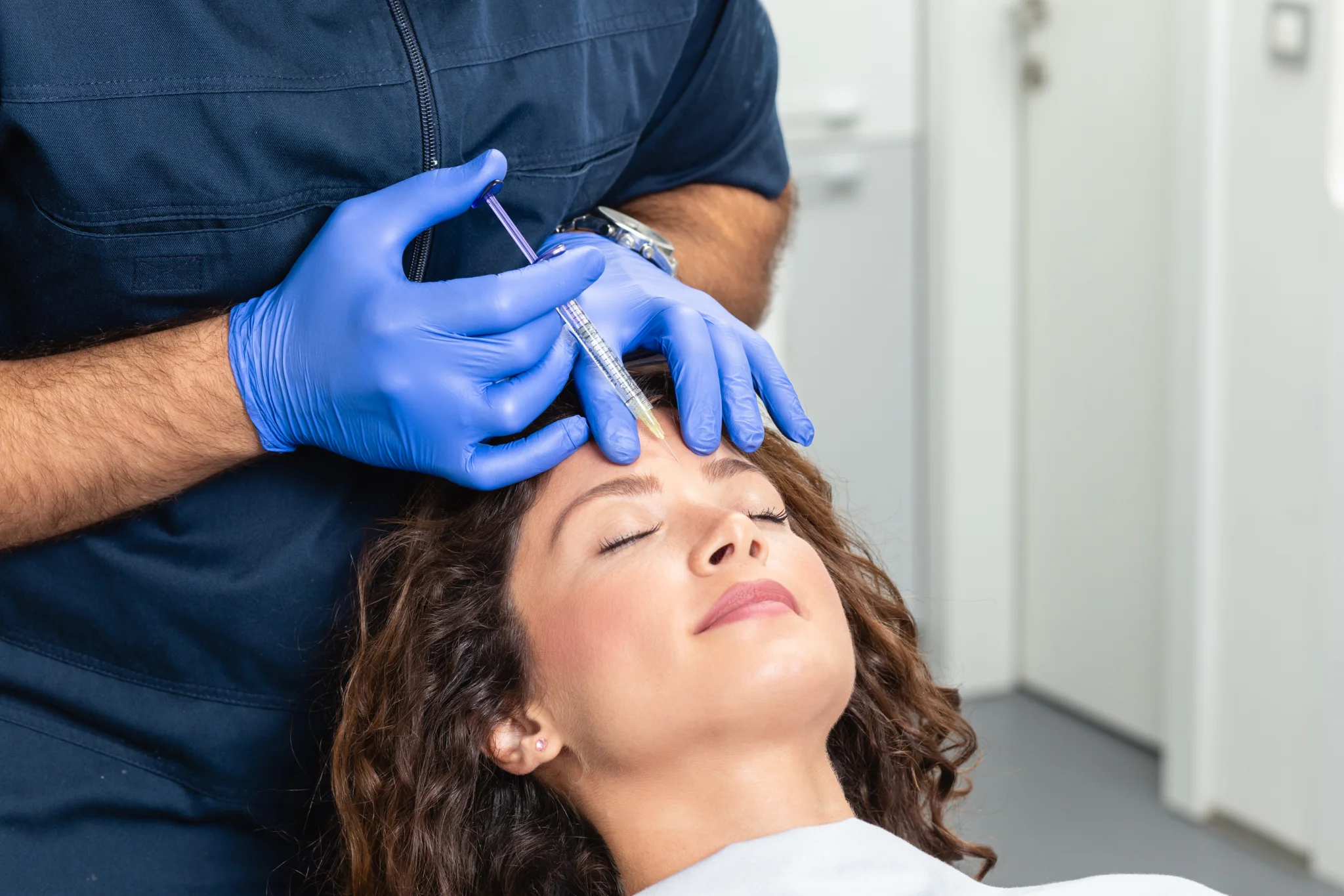 A clinician performing a cosmetic injectable treatment at a Thonotosassa medical spa serving Tampa Bay