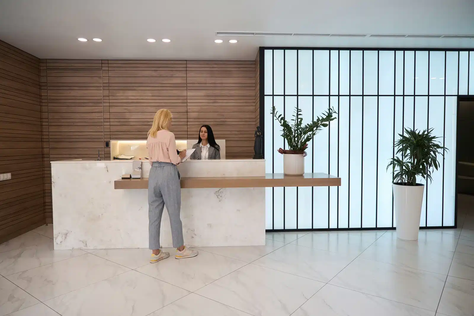 Booking a lip flip appointment at the front desk of SpaRx Medical Aesthetics in Thonotosassa, FL
