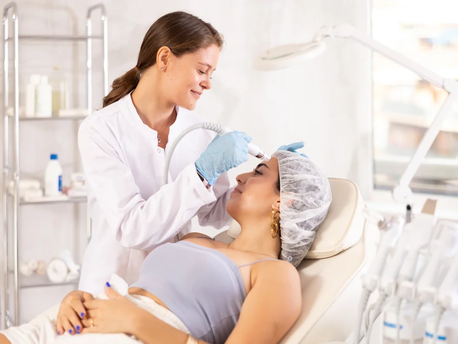 A licensed esthetician cleansing and prepping a patient's skin before an Oxy2Glo oxygen facial at SpaRx Medical Aesthetics in Thonotosassa, FL