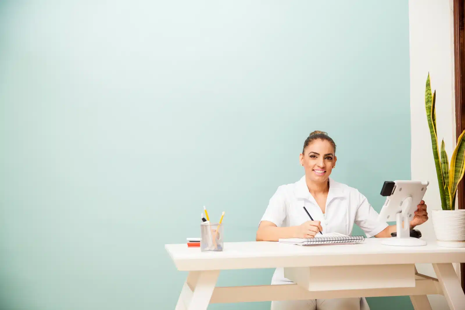 Booking a follow-up PRP or PRF session at the front desk of SpaRx Medical Aesthetics in Thonotosassa, FL