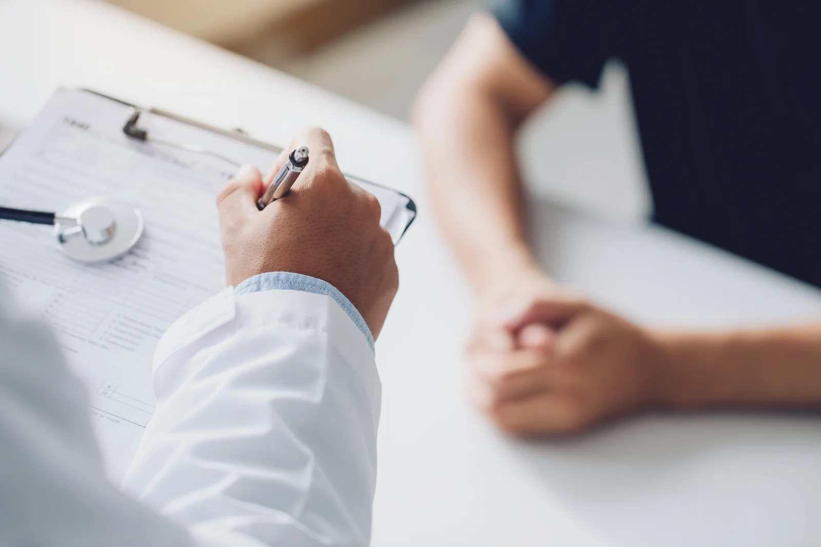 A provider reviewing a patient's health history during a PT-141 consultation at SpaRx Medical Aesthetics in Thonotosassa, FL.