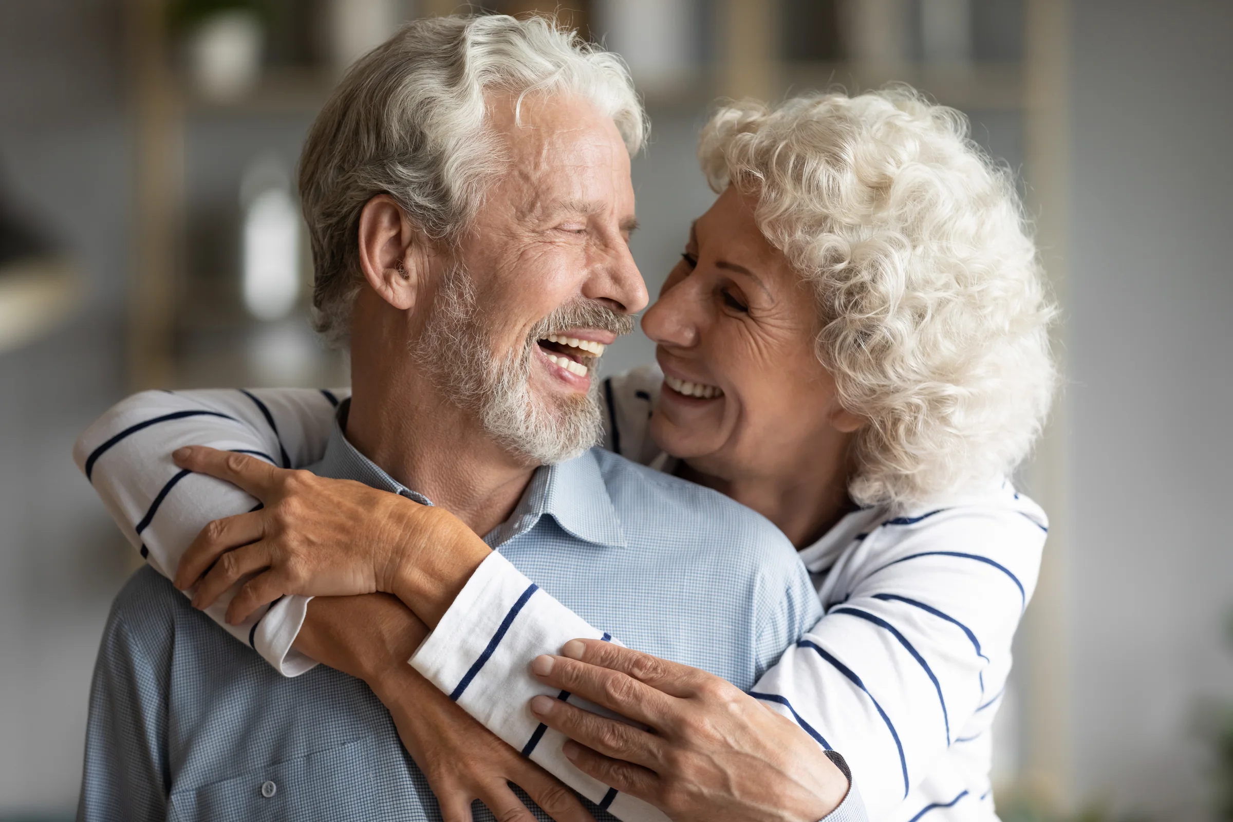 A couple sharing a warm, close moment at home, representing the intimacy and connection PT-141 therapy at SpaRx Medical Aesthetics in Thonotosassa, FL supports.