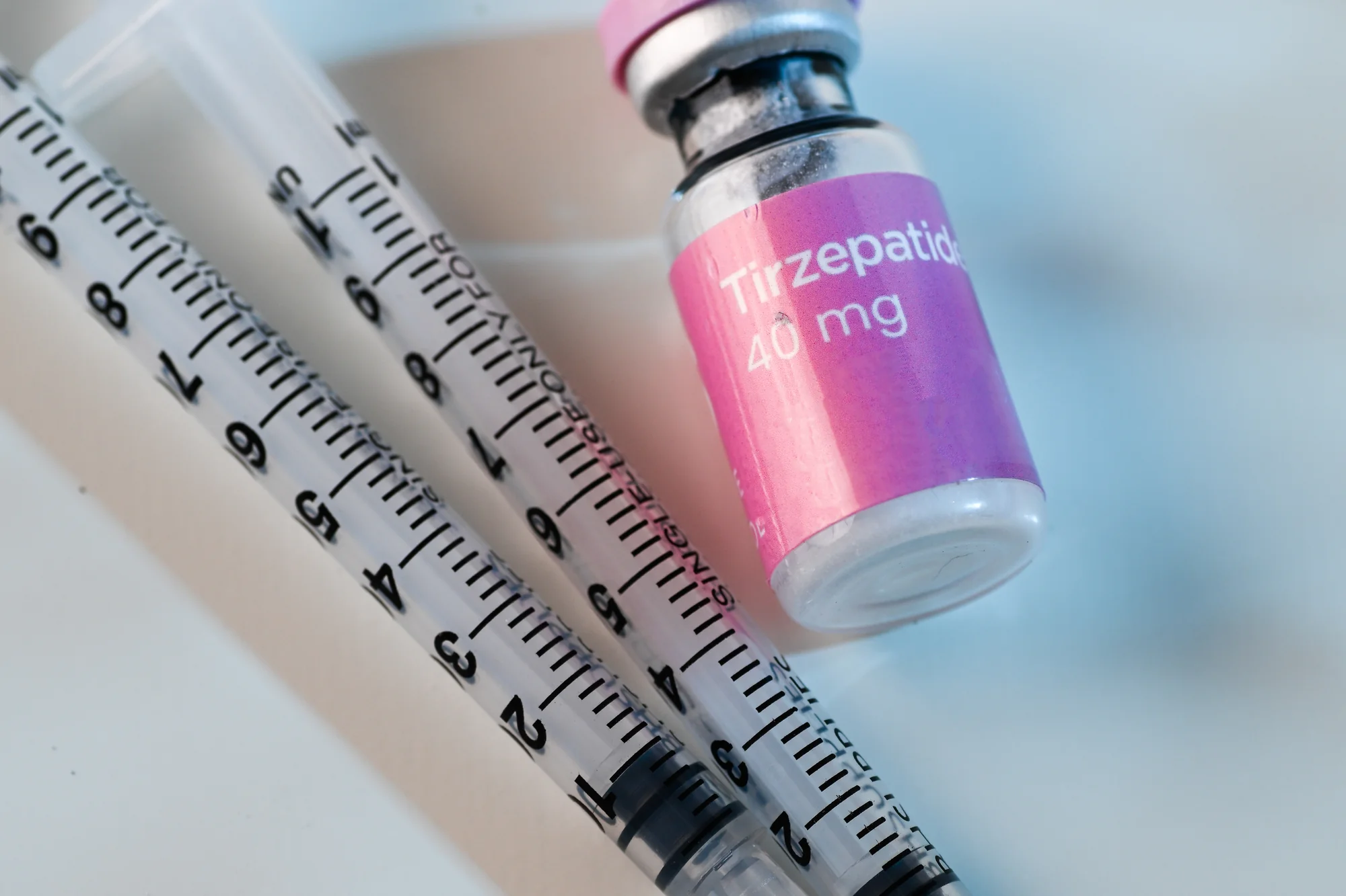 A tirzepatide medication vial and a single-use syringe, prescribed within a physician-supervised program at SpaRx Medical Aesthetics in Thonotosassa, FL.